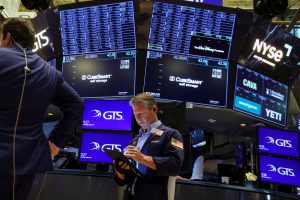 Traders work on the floor of the NYSE in New York